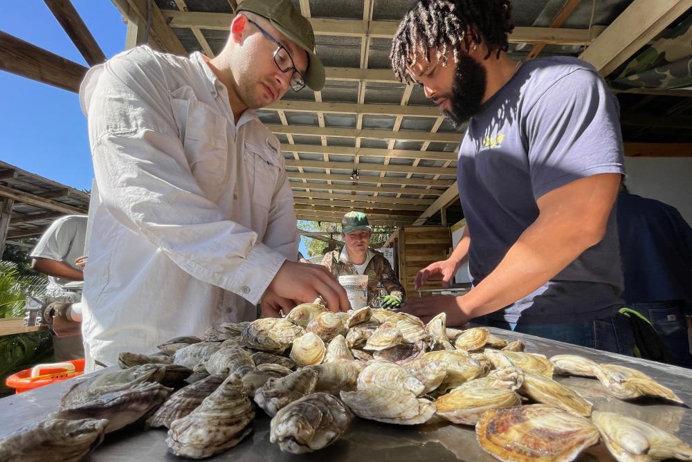 Matt LaGanke (left) plans to utilize his Ph.D. and sub-concentration in shellfish aquaculture to strengthen the connection between academic research and aquaculture farm practices.