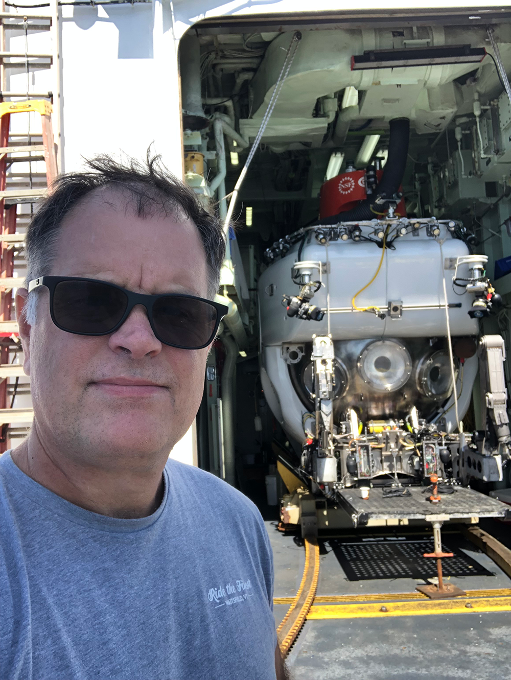 In 2023, Pohlman led an expedition on the R/V Atlantis. The DSV Alvin (pictured alongside Pohlman) was used to investigate methane seeps in Astoria Canyon.