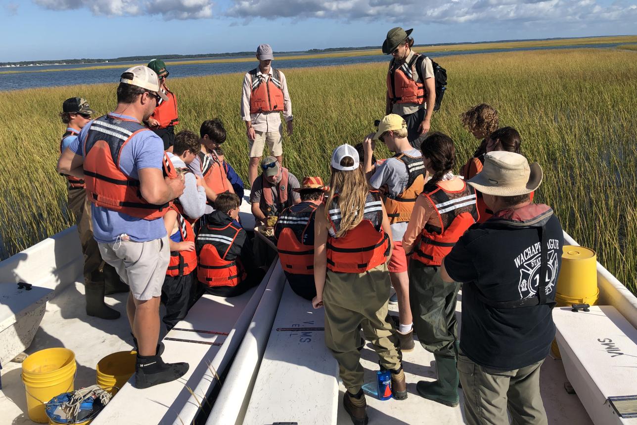 Undergraduate students on a boat