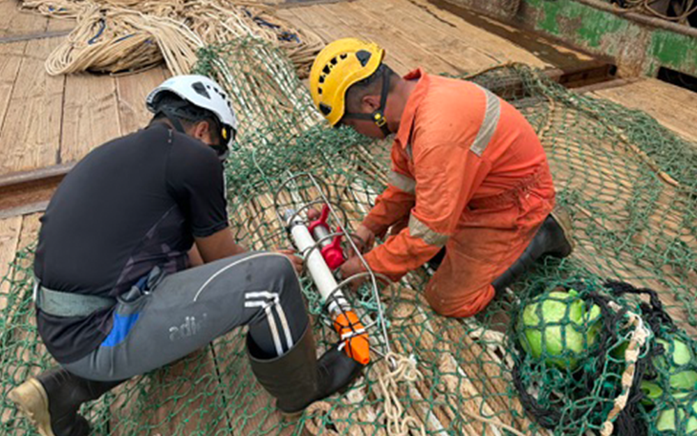 Researchers in the Indian Ocean prepare to utilize the SQUID-e, a device developed with support from the Innovation Fund. Photo provided by Paul Clerkin.