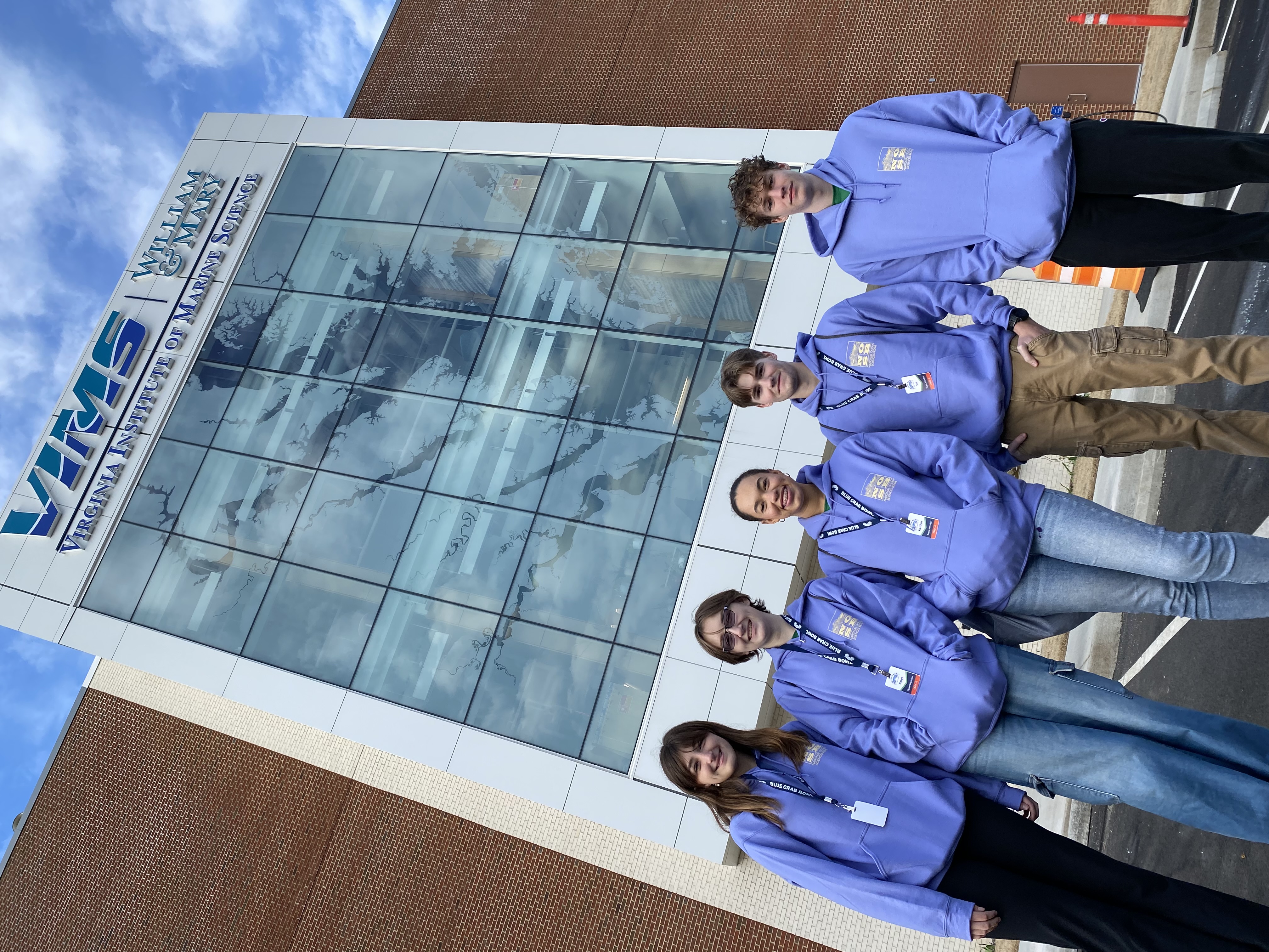 The Chesapeake Bay Governor’s School Glenns Campus team standing outside the new Chesapeake Bay Hall on the Batten School & VIMS campus.