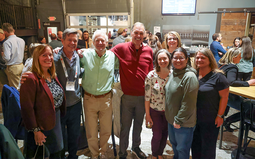Geno Olmi (center left) and Rom Lipcius (center right), alongside fellow Batten School & VIMS faculty and alumni. Photo by John Wallace.