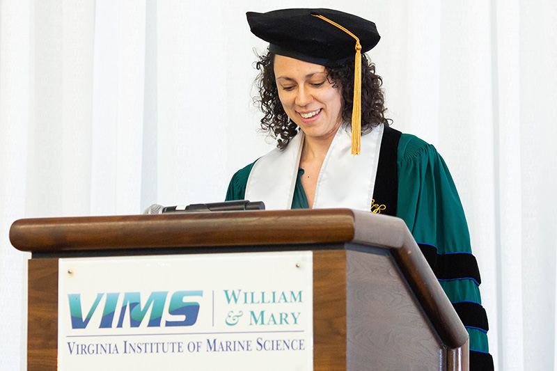 Grace Molino Ph.D '25 addressed her class, acknowledging their combined scientific and geographic impacts. Photo by Jenny McQueen