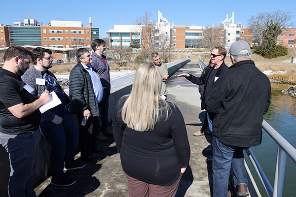 Workgroup participants gather on the pier overlooking the Batten School &amp; VIMS research farm. Photo by John Wallace