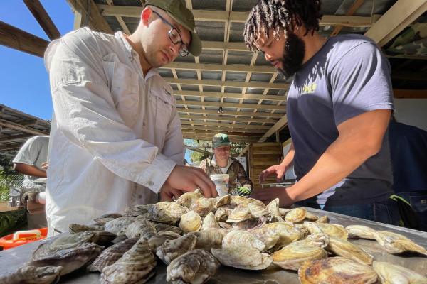 Matt LaGanke (left) plans to utilize his Ph.D. and sub-concentration in shellfish aquaculture to strengthen the connection between academic research and aquaculture farm practices.