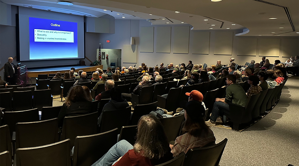 The 85 in-person attendees often erupted in laughter throughout the lecture. Photo credit: Ethan Smith